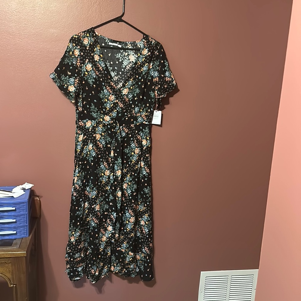 Large floral button down dress. New with tags. Never worn.